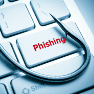 phishing / fish hook on computer keyboard